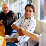 getty_rm_photo_of_smiling_man_introducing_himself_to_woman