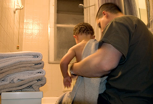 getty_rm_photo_of_father_helping_son_with_bedtime_bath