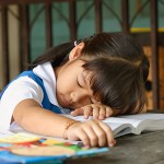 little_girl_sleeping_at_school