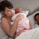 ppd-woman-in-bed-with-newborn
